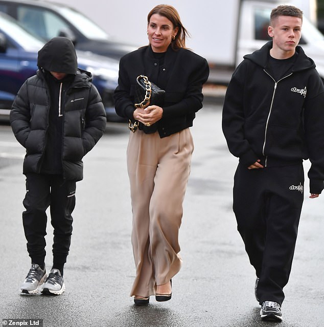 Coleen grinned as Klay ducked his head down and almost disappeared into his hoodie and Kai fiddled with his tracksuit.