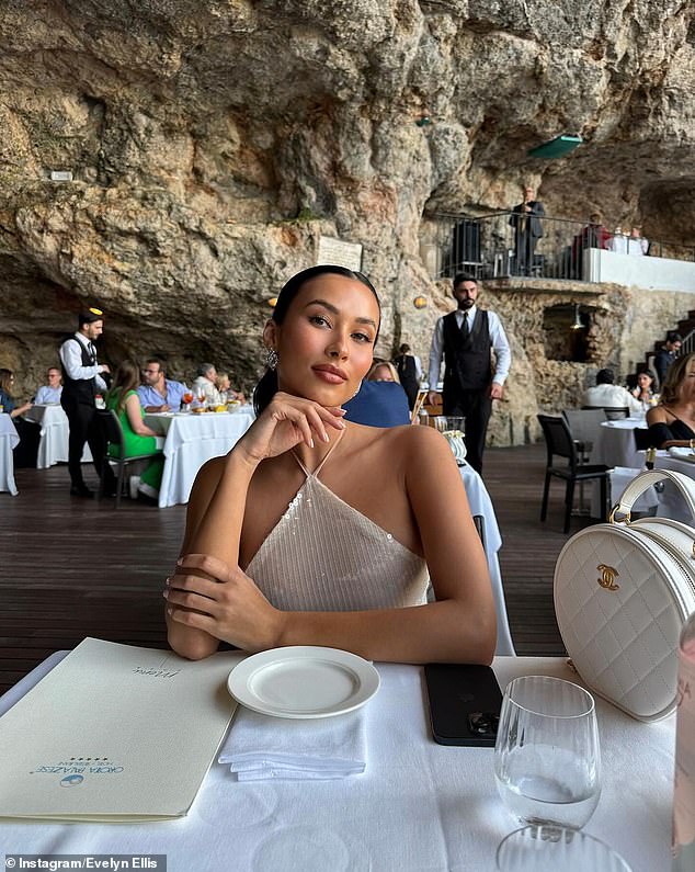 The brunette beauty turned heads in a sheer ankle-length dress and left little to the imagination as she dined at a cave restaurant in the heart of Puglia, Italy