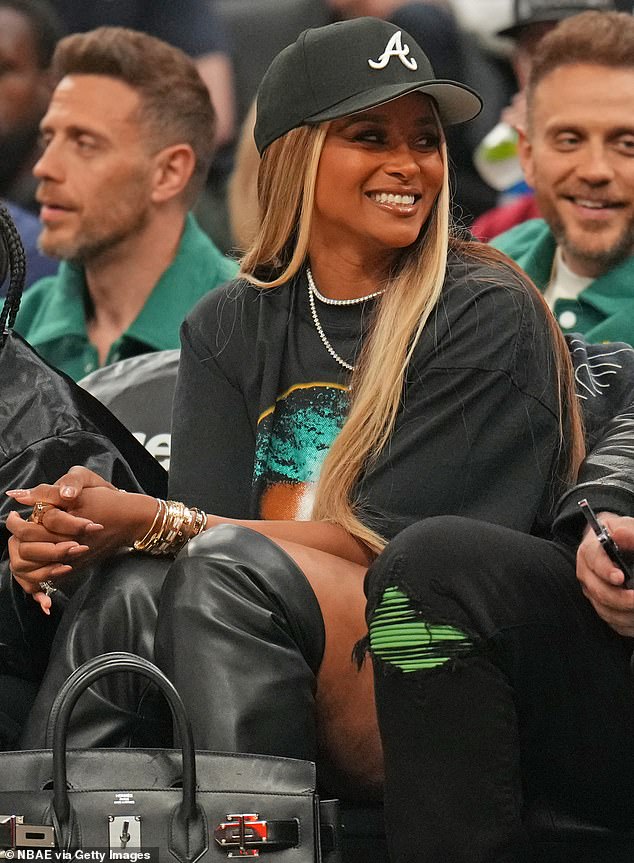 Ciara wore a black baseball cap and several gold bracelets as she sat in the front row watching the Celtics beat the Cavaliers 113-98