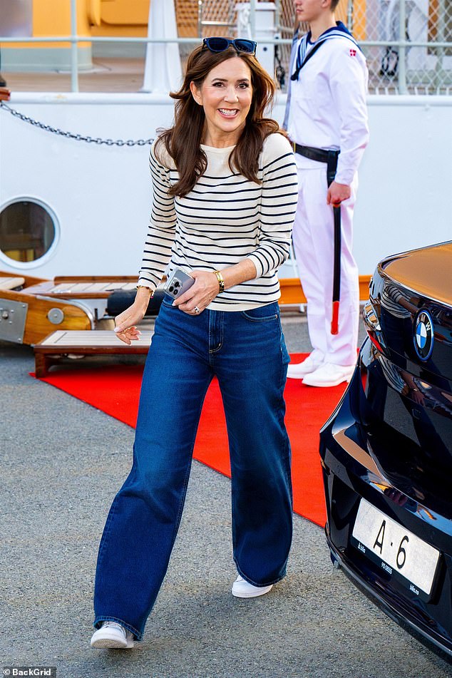 Mary opted for casual attire and wore flared blue jeans and a striped cream sweatshirt