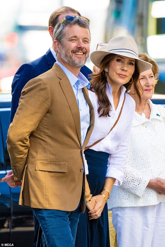 Earlier that day, Mary looked chic in a flowing blue skirt, white shirt and trendy straw fedora