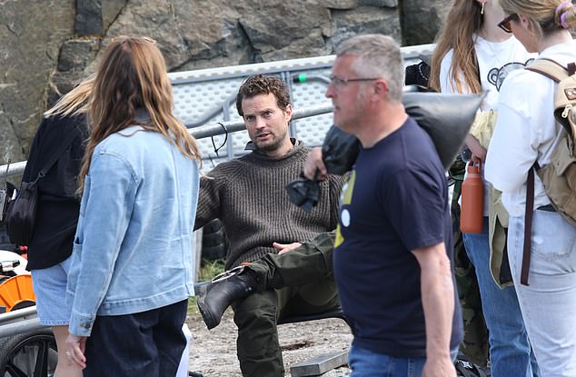 The Northern Irish actor, 42, who plays identical twins Adam and Lee in new series The Undertow, appeared in good spirits as he chatted to the crew on set