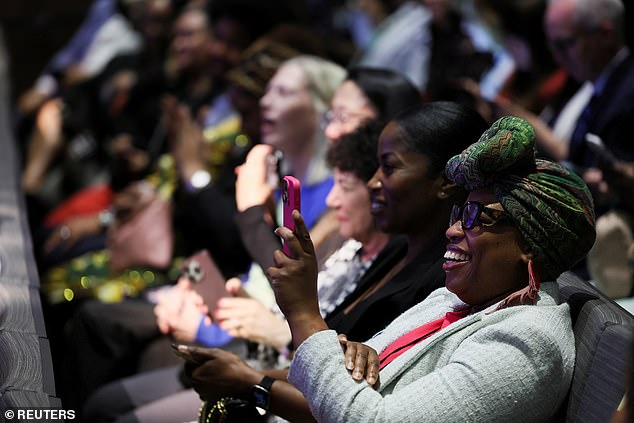 Spectators at the National Museum of African American History and Culture listen to President Joe Biden's speech