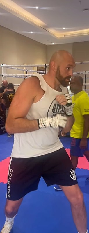 Meanwhile, Fury - who shared a photo of his slimmed-down physique on Instagram - said Usyk would have been 'in trouble' if the fight had gone ahead as planned