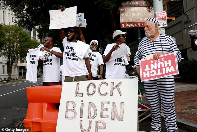 'Blacks for Trump' protesters show their support for Trump and his 18 co-defendants outside the Fulton County Courthouse on September 6, 2023 in Atlanta, Georgia
