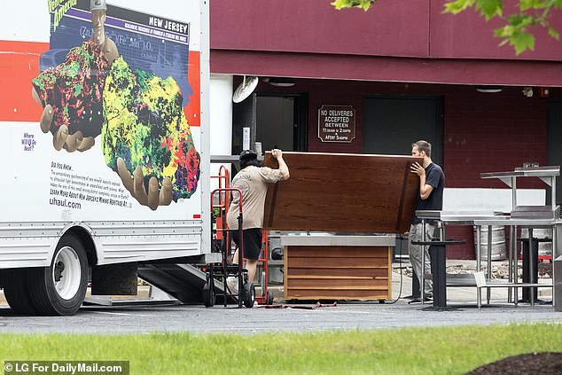 Red Lobster auction winners clear out kitchen equipment and furniture at the Red Lobster restaurant in Columbia, Maryland