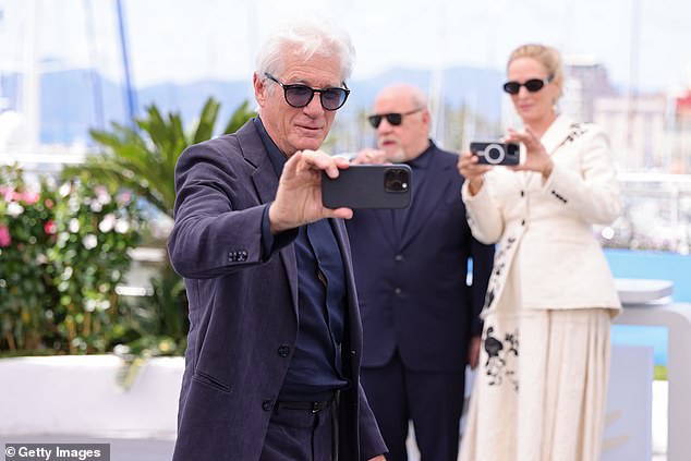 Uma and Paul posed for a selfie taken by Richard before Uma pulled out her own phone again to take one too