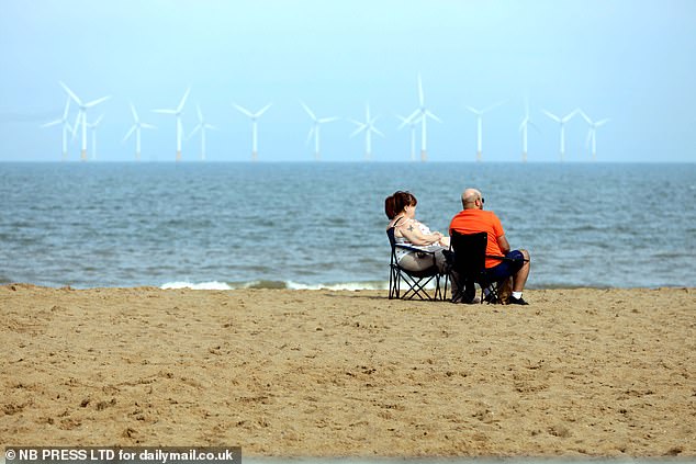 A couple relaxed on camping chairs on the beach in Skegness yesterday afternoon in the sunshine