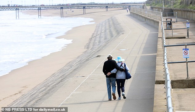 A couple took a walk along the seafront in Skegness yesterday