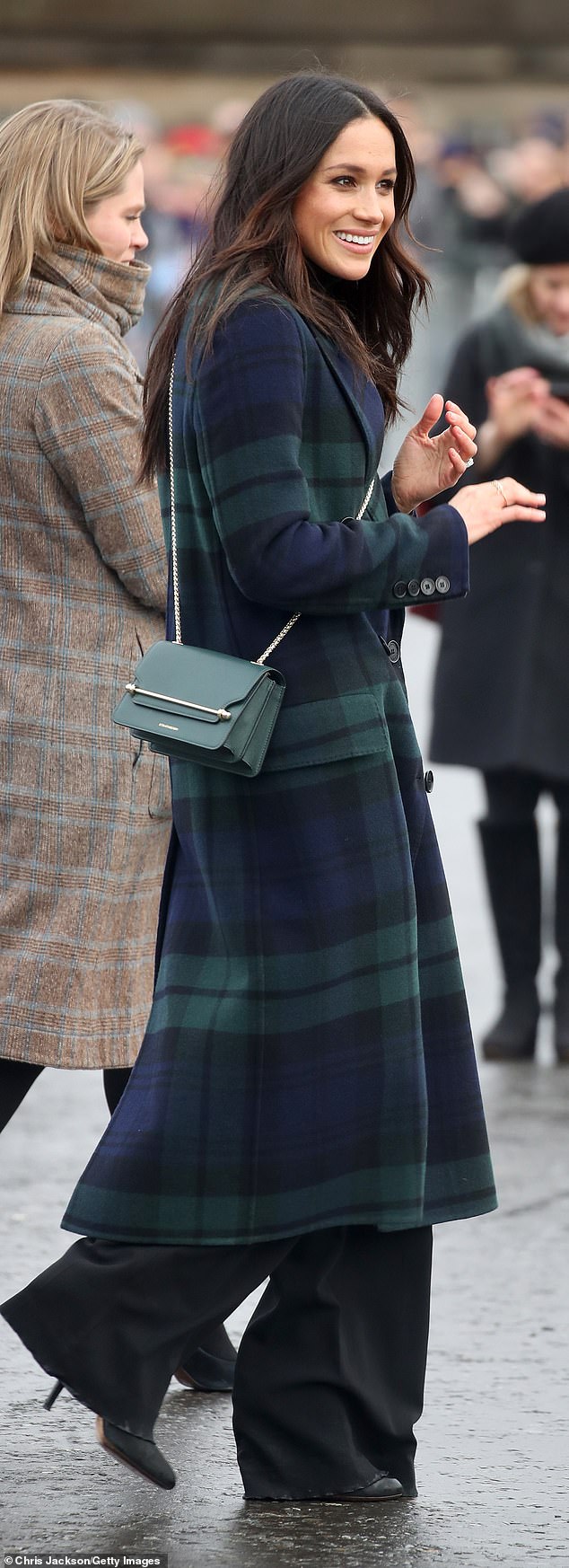 Dating back to 2019, Meghan wore long black trousers that dragged on the floor in Edinburgh