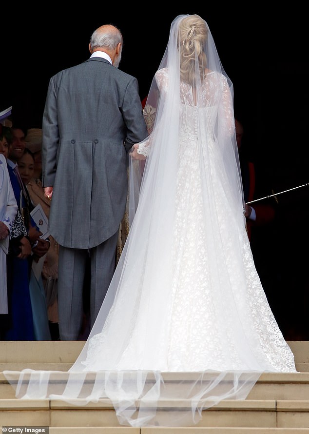 Gabriella's delicate veil was made of layers of white tulle and embroidered flowers