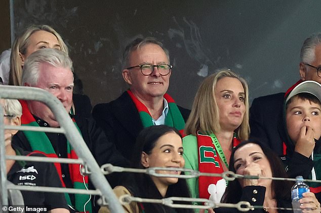 Anthony Albanese (centre) is pictured wearing a scarf from his beloved Bunnies during the Penrith Panthers vs South Sydney Rabbitohs match at Accor Stadium on September 24, 2022