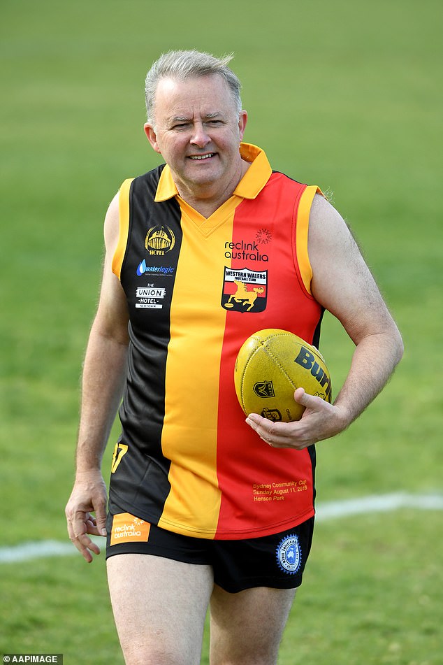 The Prime Minister has a long track record of donning the scarves, and sometimes the entire outfit, of sports teams over the years.  He is pictured warming up during the annual AFL Reclink Community Cup match at Henson Park in Marrickville, Sydney, Sunday, August 11, 2019