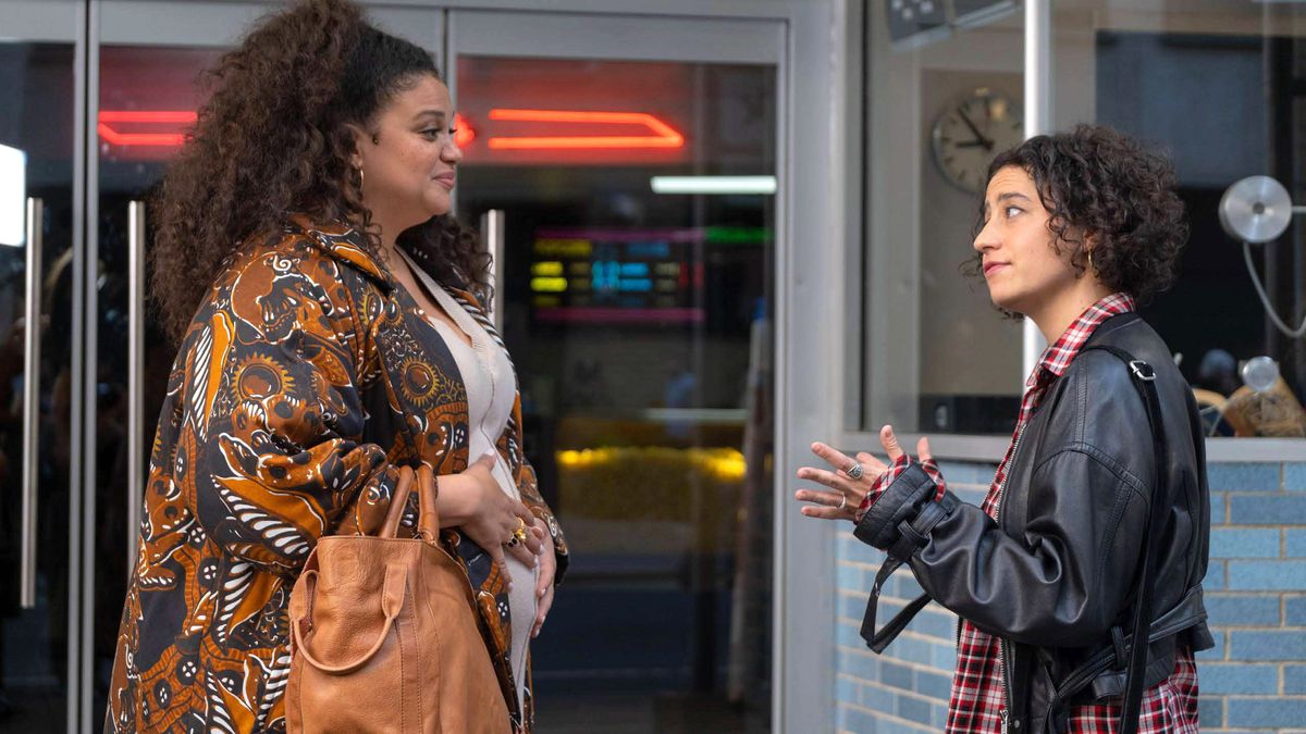 Dawn (Michelle Buteau) and Eden (Ilana Glazer) meet in front of a movie theater