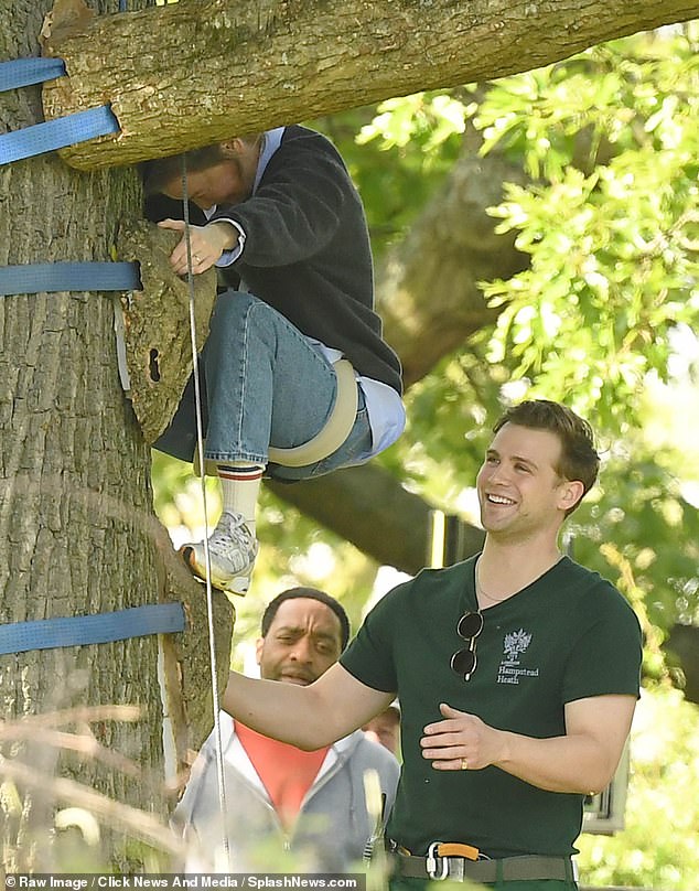 Leo Woodall's character, Bridget's toyboy Rockstar, lends a helping hand to get her down from the tree