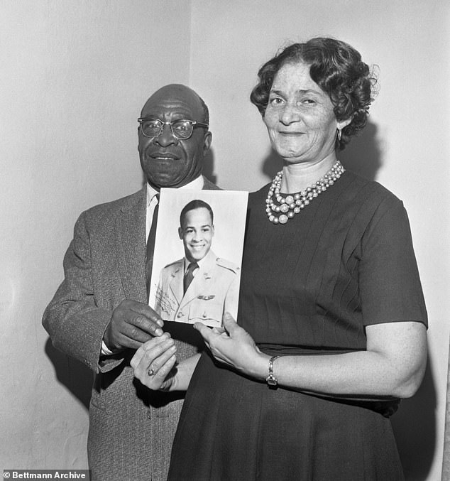 Pictured: Mr. and Mrs. Edward Dwight Sr.  hold a photo of their son, Edward Dwight Jr., who is the first African American selected as a possible astronaut