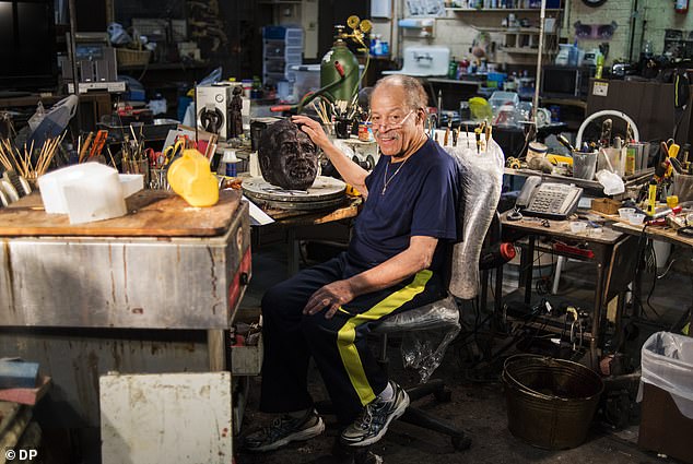 Pictured: Dwight poses for a portrait in his workspace, which he sculpted in his studio in Denver, Colorado