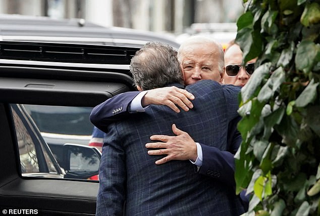 President Biden hugs his son Hunter after they leave a restaurant on Hunter's Birthday in Los Angeles on February 4, 2024