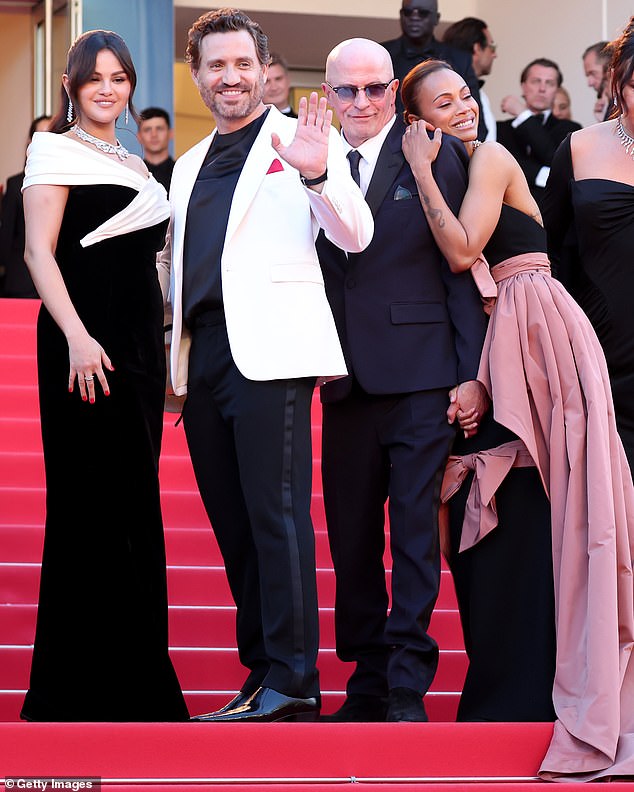 Selena stepped out in a black dress with an elegant white neckline, while Edgar and director Jacques Audiard, 72, (second from right) cut trim figures.