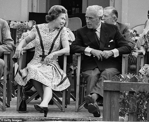 Queen Elizabeth II pictured speaking to Lord Louis Mountbatten at the Guards Polo Club on June 1, 1975