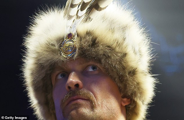 The Ukrainian fighter wore a green robe and an ushanka as he headed to the ring to fight