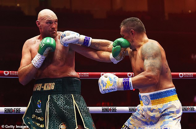 Usyk (right) came back late in the fight to seal the win over Fury, knocking the British fighter down in the ninth round