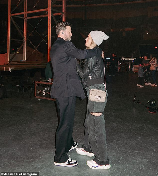 Another image captured a sweet moment between Biel and Timberlake as they stood close together backstage