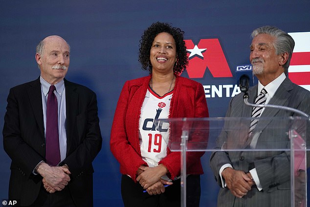 Bowser (pictured center) recently attended an elaborate $5,000-per-person golf tournament