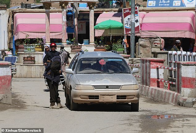 Four people have been arrested after the shooting in Bamyan City, central Afghanistan (Photo: An Afghan security force member checks a vehicle after the shooting)