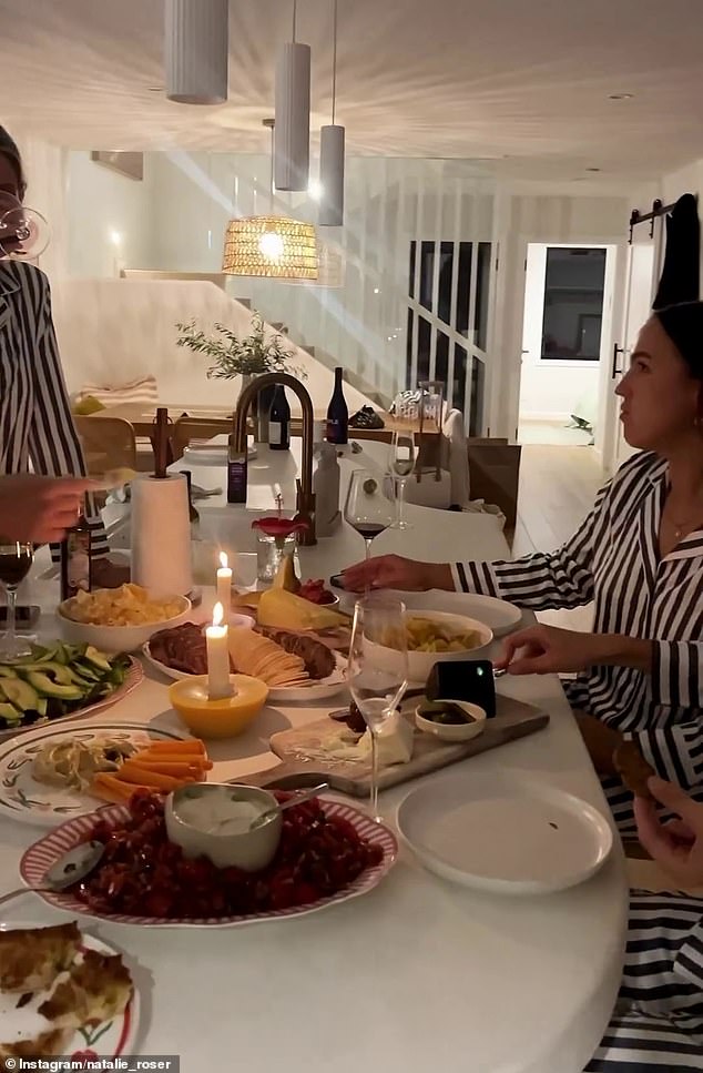 The model, who recently courted controversy for joining OnlyFans, posted to Instagram a video of herself enjoying a decadent, home-cooked feast with her friends in the kitchen