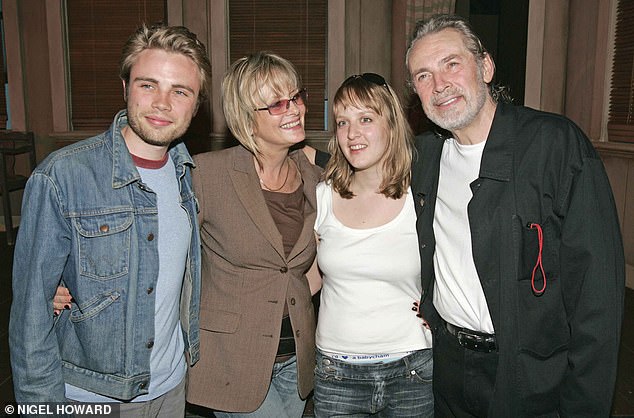Twiggy opened up to the September issue of Good Housekeeping because of their past experiences with love.  She and Leigh have always been 'a little softer' with their romance (pictured in 2004 with Twiggy's daughter Carly and Leigh's son Jason)