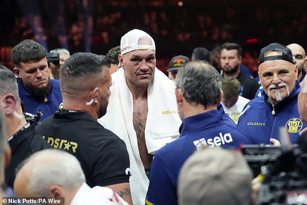 Fans suggested that John Fury, right, was less visible and vocal after Usyk's win