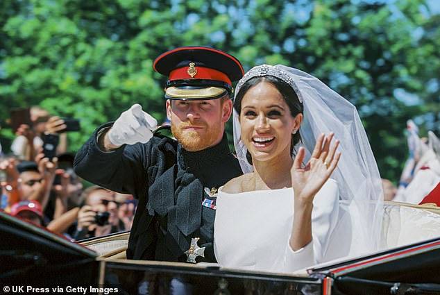 The crowds and sunshine made the happy couple beam as they greeted the crowd