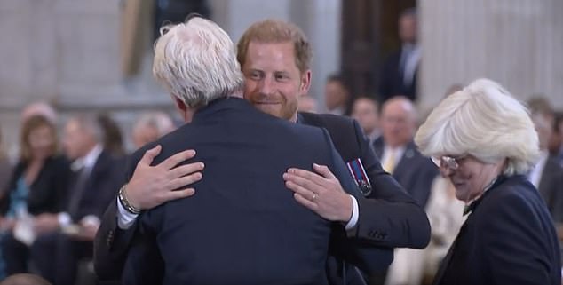 Harry smiled and blew kisses to his 'loyal' blood family, the Spencers.  Above: Harry hugs his uncle Earl Spencer at St Paul's