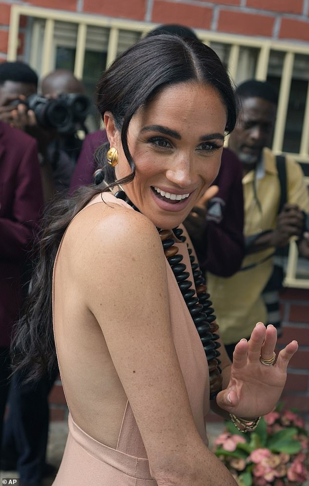 Meghan may be tone deaf: During recent non-royal visit to Nigeria, she wore a Cartier watch and backless, almost frontless dresses
