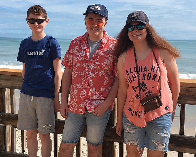 Mrs Bowie, pictured with Nathan 22 and Michael 19 on their last holiday before getting the vaccine
