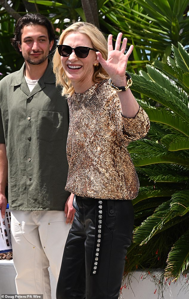 The actress also wore black sunglasses amid the French sun as she waved to reporters