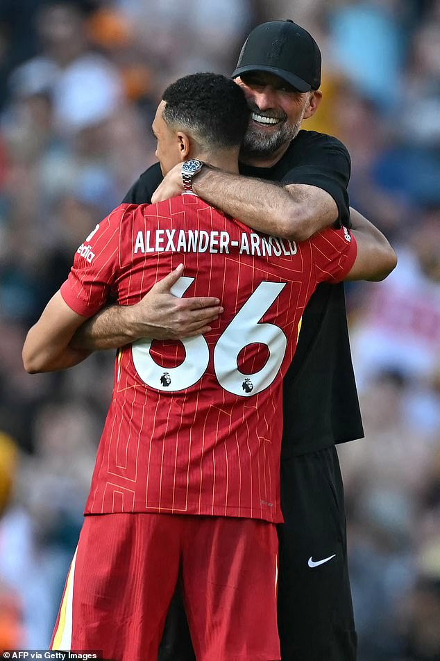 Jurgen Klopp hugs Trent Alexander-Arnold on the pitch after his last game against Wolves