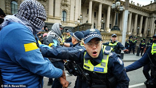 Police tried to keep the two groups apart while supporting people's right to peaceful protests