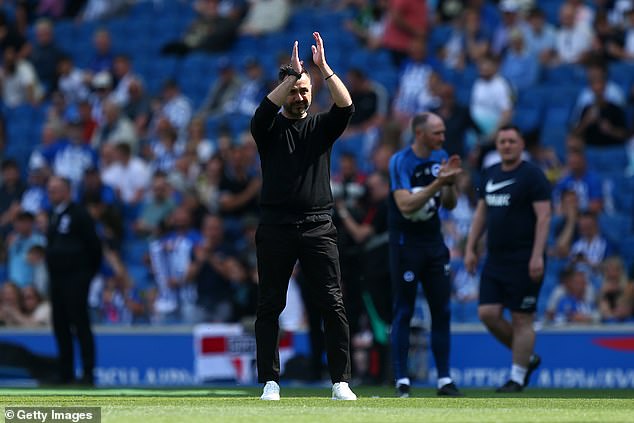 Roberto De Zerbi cheers on the Brighton fans ahead of kick-off in what was his last game there