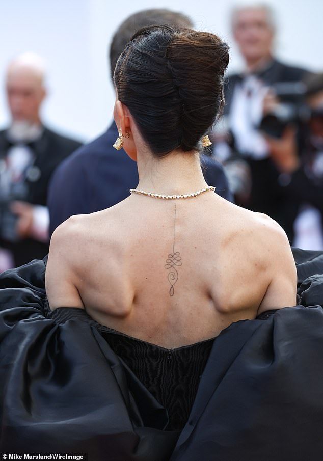 The actress, best known for her work in Bollywood, showed off her simple black tattoo on her spine