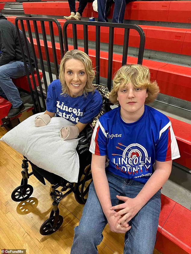 Mullins, pictured next to her son at a school event while recovering from a quadruple amputation