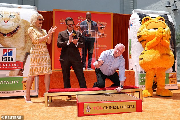 Garfield creator, Jim Davis, received the rare honor of placing his signature and handprints in the cement in front of the historic TCL Chinese Theater.  Davis, 79, also served as executive producer of The Garfield Movie