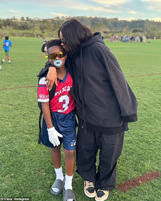 Ciara can also be seen giving Future a kiss on the cheek after a flag football game