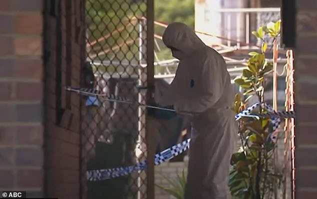 Forensic teams are pictured at the unit on College Street in East Lismore, on NSW's Far North Coast, on Monday