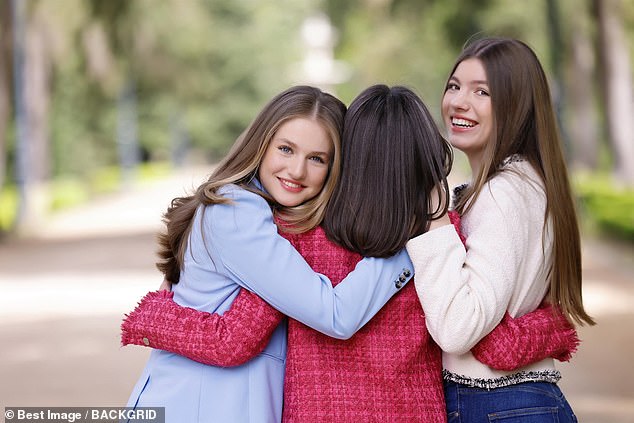 Close to;  a sweet photo of Queen Letizia embracing her daughters was also released in the official anniversary set