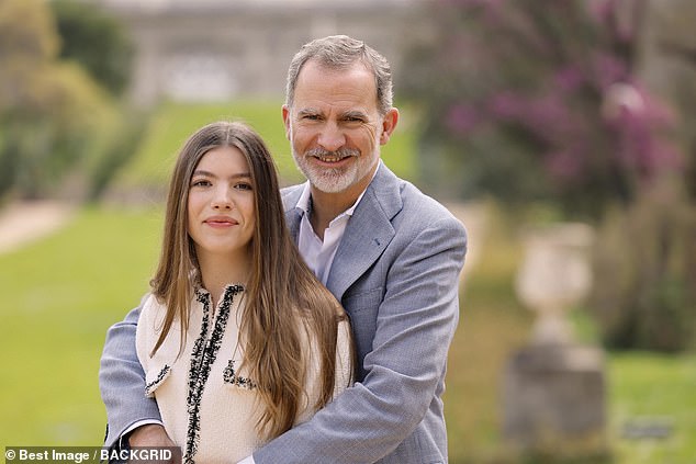 And Crown Princess Sofia is seen in a similarly loving pose with King Felipe in the grounds of the sprawling Madrid estate the family calls home