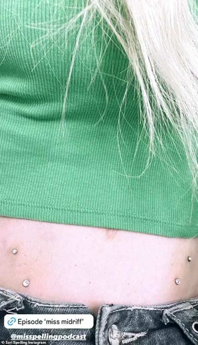 The actress took to her Instagram Story to share a photo of her bare midriff with her crop top pulled up to reveal her new dermal hip piercings.  She shared a close-up photo of her stomach, now adorned with diamond body jewelry above her hips