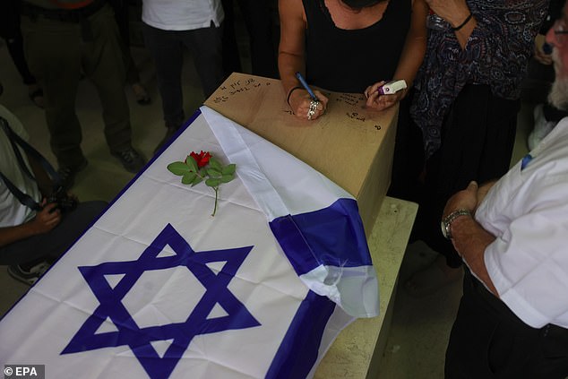 Relatives and relatives were writing on the coffin last night during the funeral