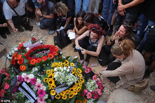 The German-Israeli was one of the 364 people killed during the SuperNova Festival, which she attended with her boyfriend.  Flowers are laid at her grave yesterday